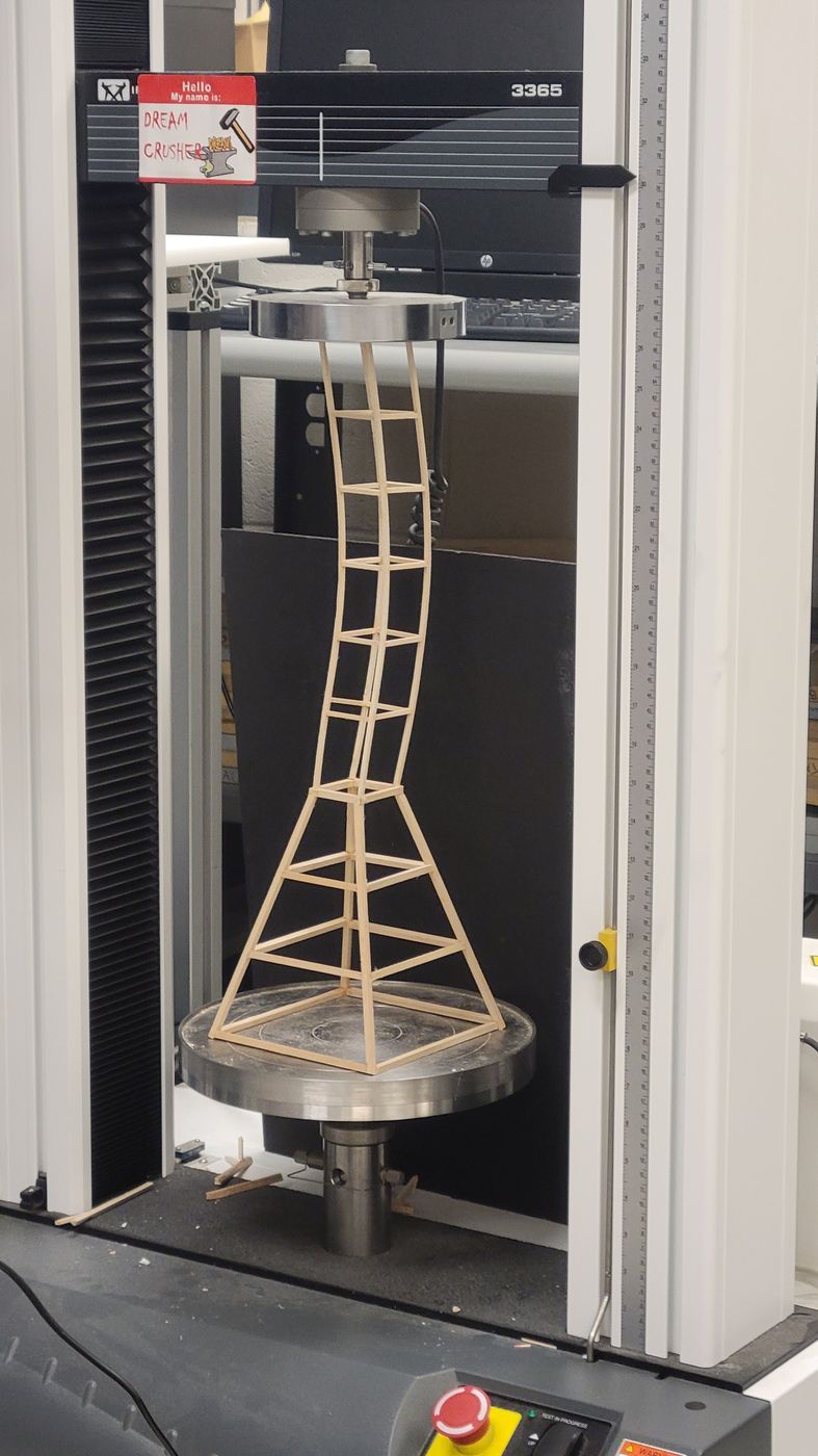 Tower being load-tested in a universal testing machine